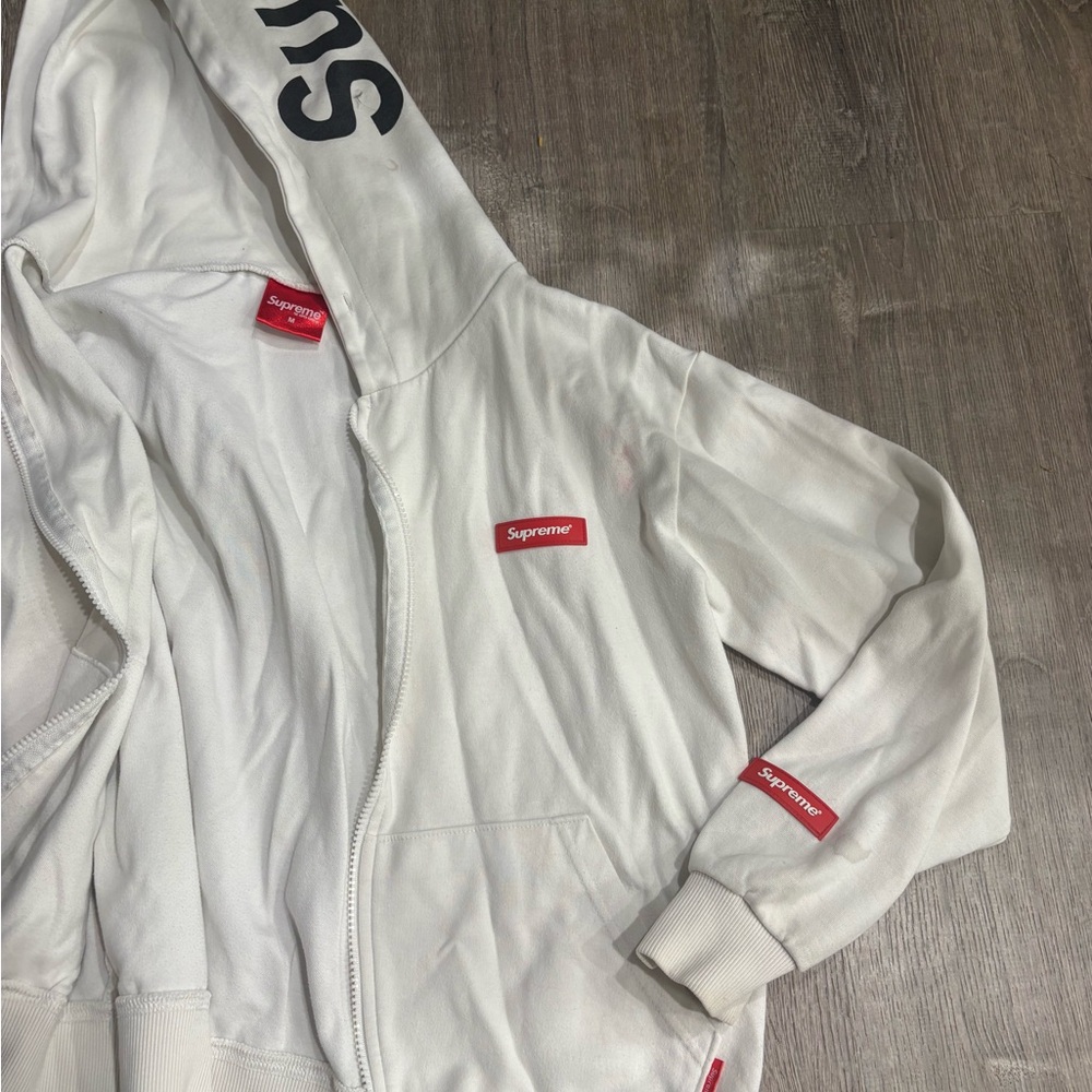 Supreme White Zip-Up Hoodie with Red Details